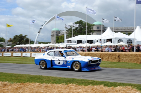 The Ford Cologne Capri powers past Goodwood House.