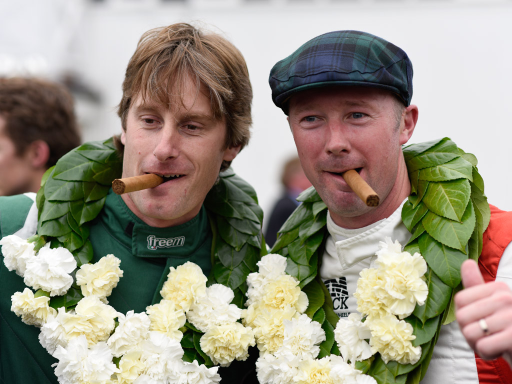 Chris Ward and Gordon Shedden celebrate claiming the prestigious RAC TT Celebration title at this year's Goodwood Revival