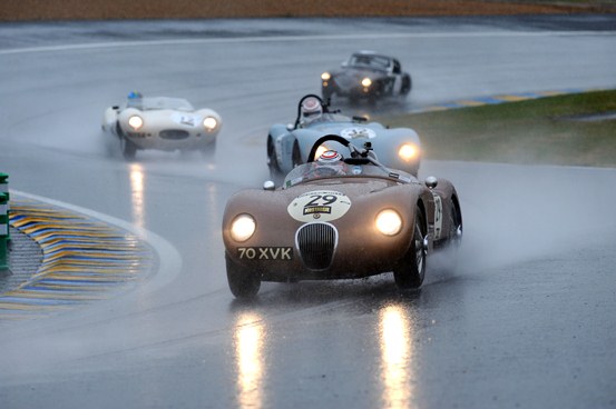 Alex Buncombe battled some precarious weather conditions to dominate Plateau 2 with a double victory in the ex-Fangio C-Type.