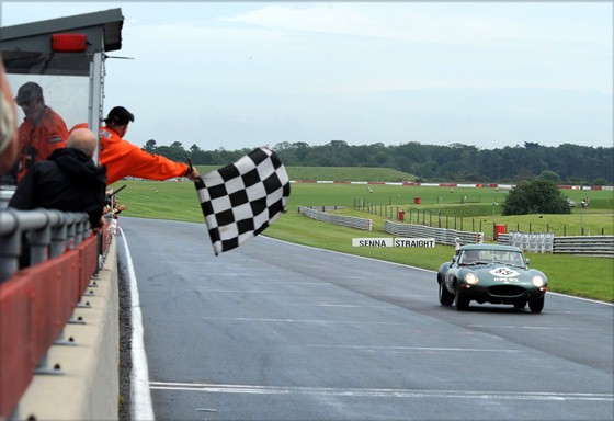 The JD Classics E-Type takes the chequered flag in an unrivalled victory in the 3-Hour Race.