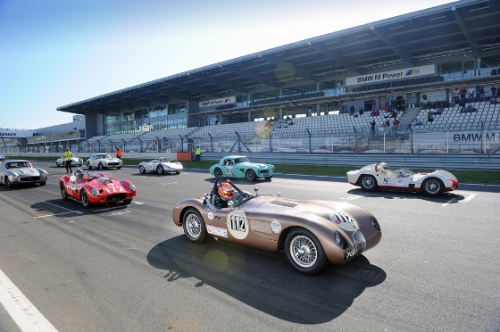 The ex-Fangio C-Type lines up on the front line of the grid ahead of the '60/'61 Sports and GT Car Race 